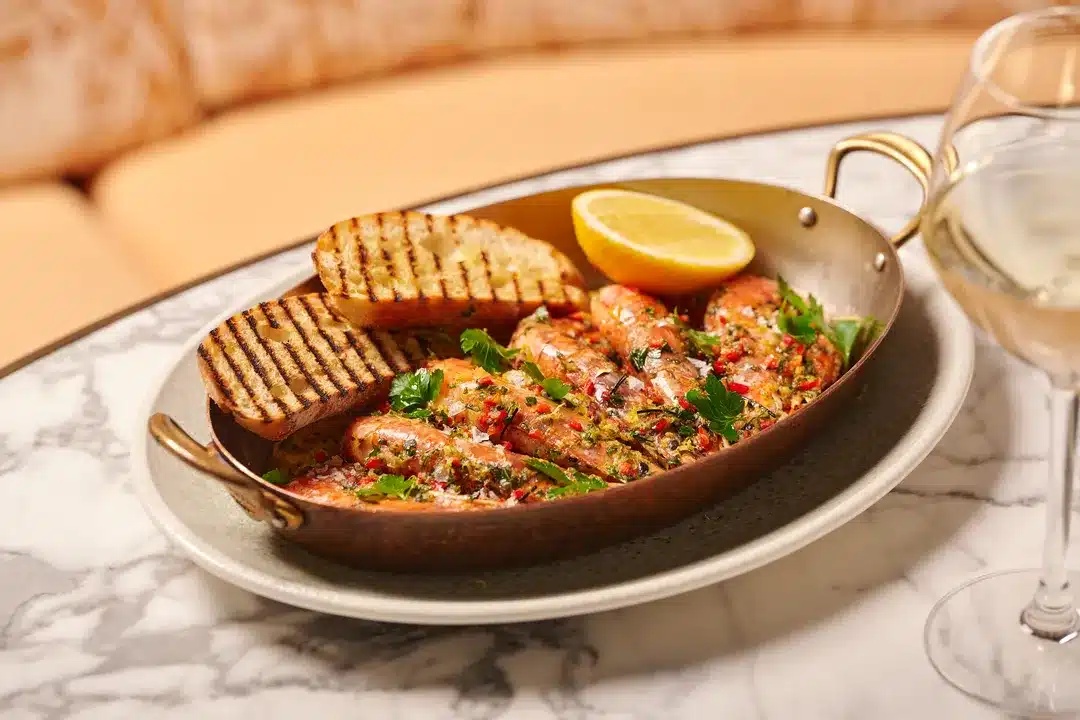 Gamberoni Rossi al Salmoriglio featured on our seasonal Italian menu